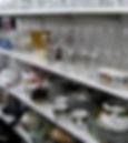 thrift shop glassware plates mugs bowls.